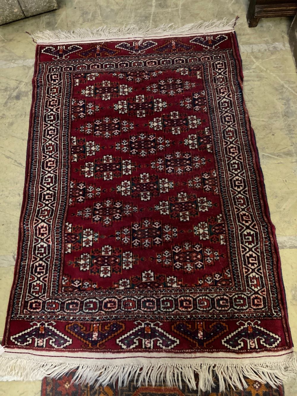 A Bokhara rug and a Turkish geometric rug, larger 150 x 100cm